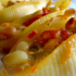 Conchiglie con piñones, queso y pimientos