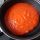 Rollitos de merluza, jamón y queso en salsa de tomate y piquillo