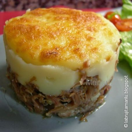 Confit de pato con puré de patata al aceite de trufa