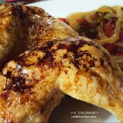 Coquelet o pollo tomatero al horno con guarnición